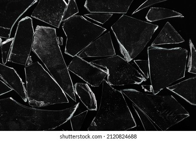 Glass Shards Isolated On Black Background.