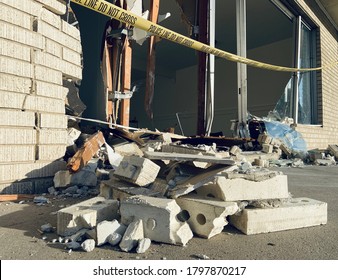 Glass Shards, Rubble, And Bricks On Ground In Front Of Smashed Small Business Storefront Draped With “police Line Do Not Cross” Tape