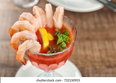 Glass With Shrimp Cocktail And Tomato Sauce On Table, Closeup