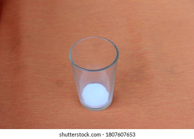 The Glass With Small Amount Of Milk