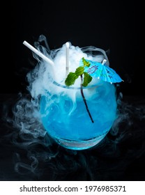 A Glass Of Smoky Cold Blue Liquid Nitrogen Cocktail