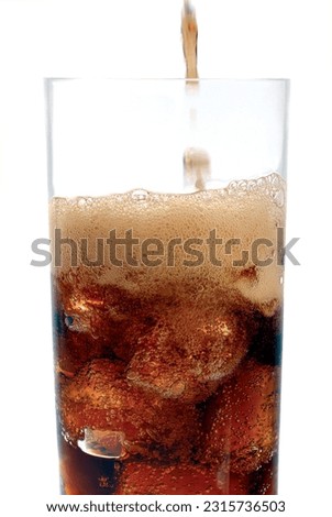 Glass with soda drink. Coke and ice.