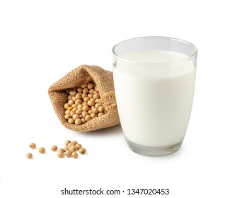 Glass of Soy milk with soybeans in bag isolated on white background.