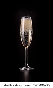 Glass Of Sparkling Champagne With Bubbles On Black Background
