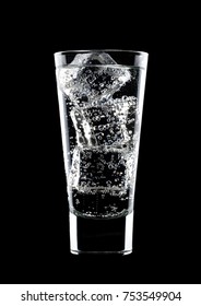 Glass Of Sparkling Water Soda Drink With Ice On Black Background