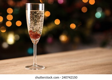 A Glass Of Sparkling Wine With Jam On The Table