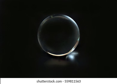 Glass spear ball globe transparent on black background 