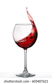 Glass With A Splash Of Red Wine Isolated On White Background