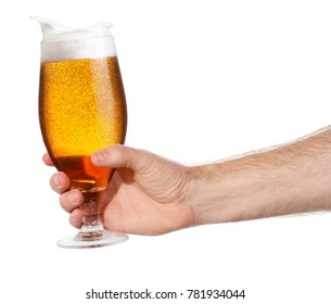 Glass Of Splashing Beer Isolated On White Background. Male Hand Making Toast