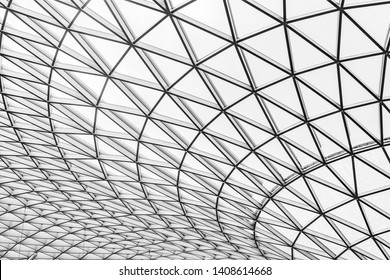 Glass and steel building with triangle pattern structure. Futuristic architecture. Neo-futurism architectural style. White triangle geometric dome texture. Creative art design of modern building.  