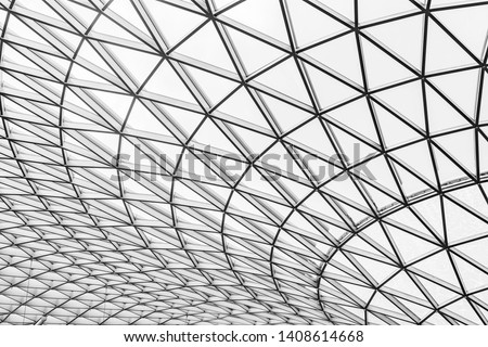 Glass and steel building with triangle pattern structure. Futuristic architecture. Neo-futurism architectural style. White triangle geometric dome texture. Creative art design of modern building.  