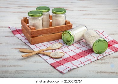 Glass Storage Containers In Various Sizes. Glass Jars With Milk Salt, Rice Flour And Baby Food, For Storage And To Decorate The Kitchen.