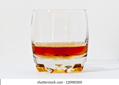 Glass Of Straight Bourbon Whiskey On Light Background.