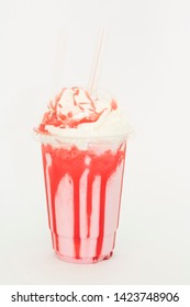 Glass Of Strawberry Ice Cold Frappuccino With Straw.