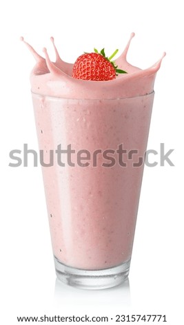 glass of strawberry smoothie or milkshake with splash and falling berry isolated on white background