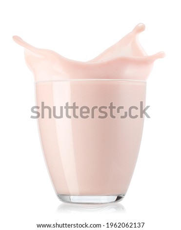 glass of strawberry yogurt with splash isolated on white