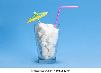 Glass With Sugar Cubes As A Concept Of Drink With Too Much Sugar