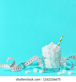 Glass With Sugar Cubes And Measuring Tape. Weight Control Diet Detox Concept