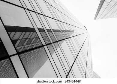 Glass Surface Of Skyscrapers View In District Of Business Centers With Reflection On It, Black And White 