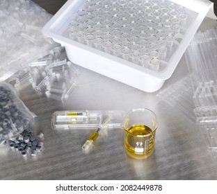 Glass Syringes And Lab Equipment On A Stainless Steel Table 