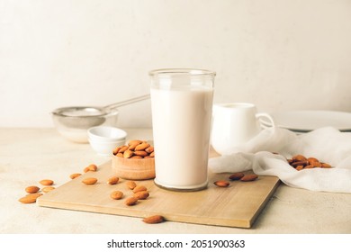 Glass Of Tasty Almond Milk On Light Background