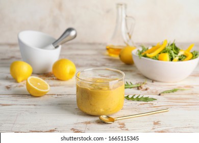 Glass Of Tasty Honey Mustard Sauce On White Wooden Table