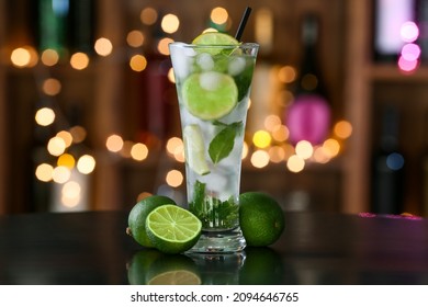 Glass Of Tasty Mojito On Table In Bar