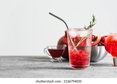 Glass Of Tasty Pomegranate Cocktail On Table