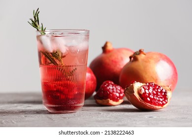 Glass Of Tasty Pomegranate Cocktail On Table