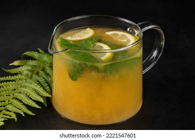 Glass Teapot With Hot Citrus Tea From Oranges, Lemons And Mint. Hot Autumn Drink