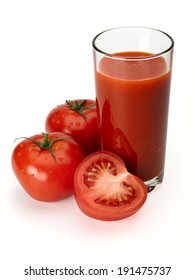 The glass with tomato juice and three tomatoes is isolated on white 