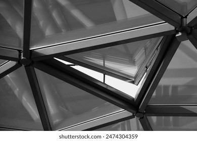 glass transparent roof. sky and sunset sunlight during evening. Roof design, construction, modern ideas. triangle window frame. opened window frame.