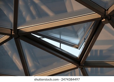 glass transparent roof. sky and sunset sunlight during evening. Roof design, construction, modern ideas. triangle window frame. opened window frame.