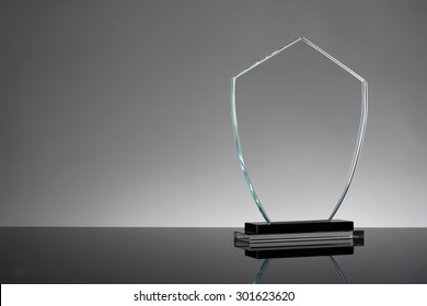 Glass Trophy In Gray Background