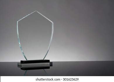 Glass Trophy In Gray Background