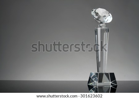 glass trophy in gray background
