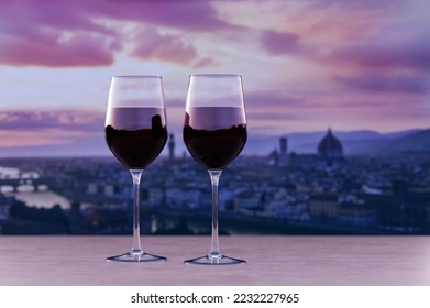 Glass of two red wine with view of sunset over Florence downtown - Shutterstock ID 2232227965