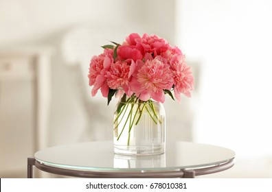 Glass Vase With Beautiful Peonies On Table