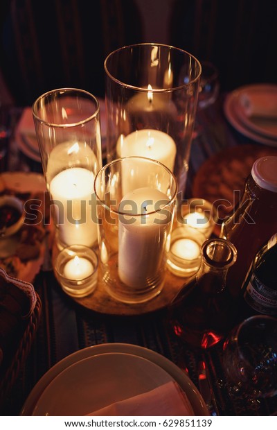 Glass Vases Shiny Candles Stand On Royalty Free Stock Image