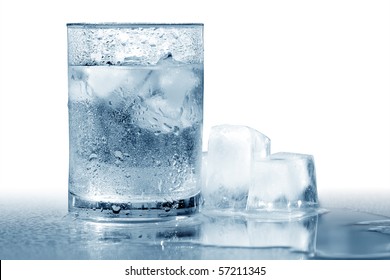 Glass Of Very Cold Water With Ice Cubes. Isolated With Clipping Path