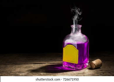 Glass vial with a purple potion on a dark background. Magic elixir. Copy space for text. 3D rendering