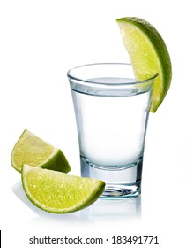 Glass Of Vodka Shot With Fresh Lime Isolated On White Background