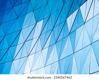 Glass wall Triangle pattern Blue colour reflection Modern background - Powered by Shutterstock