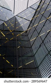 Glass Walls Of Modern Skyscrapers Viewed And Deformed By A Glass Ceiling. Abstract Op Art Effect.