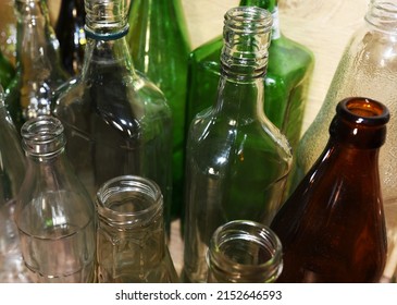 Glass Waste For Recycle. Empty Glass Bottles From Beer Wine And Champagne. Ecology And Environment Concept. Glass Bottle Recycle. Glass Bottles For Reuse. 
