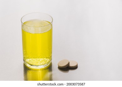 Glass Of Water With Electrolyte Fizzy Tablet For Hydration, Isotonic Drink Helpful For Sport Nutrition Or Medicine.