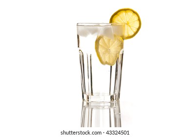 Glass Of Water With Lemon And Ice Isolated On White