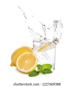 Glass Of Water With Lemon And Mint On White Background