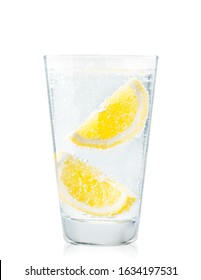 Glass Of Water With Lemon Slices In Close-up On A White Background. Isolated