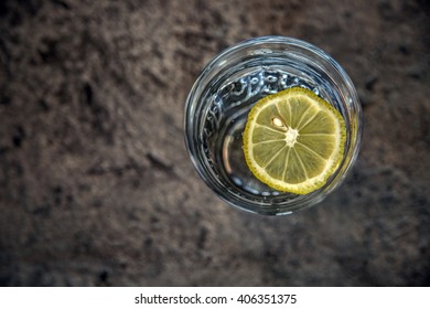 Glass Of Water With Lemon. View From Above